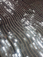 Hypnotic Sequins on Coral Tafetta Fabric Sold by The Yard
