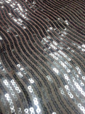 Hypnotic Sequins on Coral Tafetta Fabric Sold by The Yard